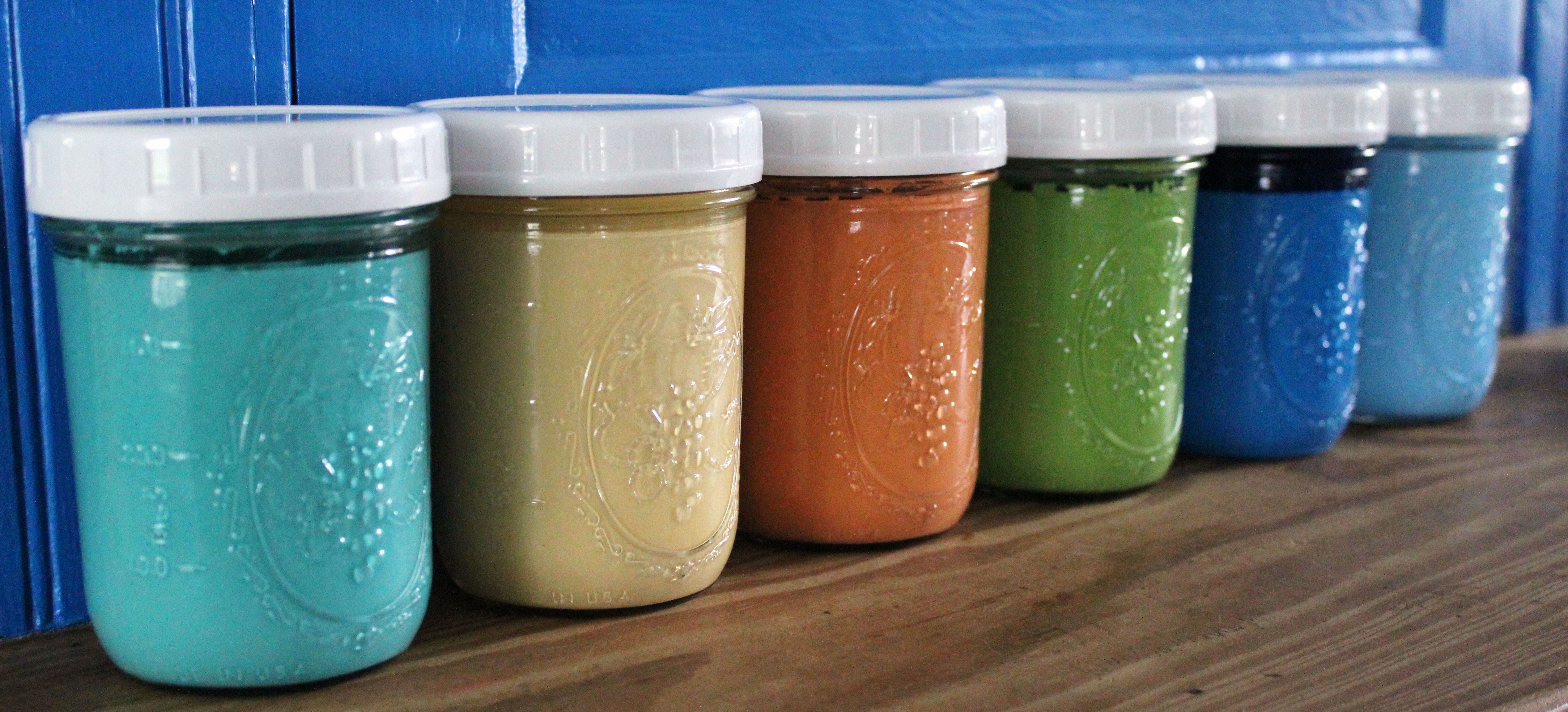 Using canning jars to store touch-up paints.
